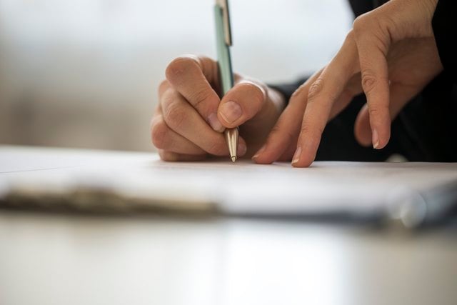 Does My Loan Cosigner Have to Be on the Title or My Car Registration?