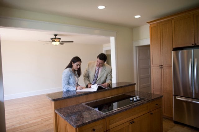Who Pays Property Taxes & Homeowners Insurance in a Land Contract?